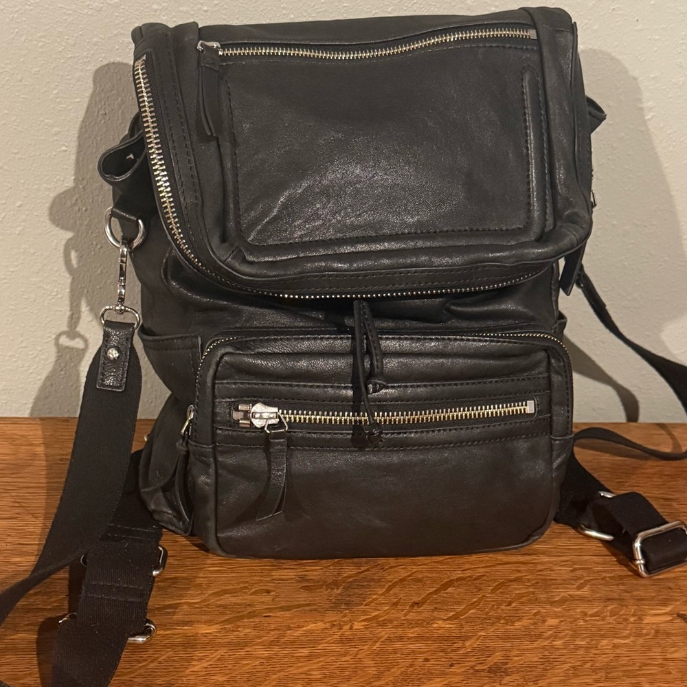 Vince Camuto backpack. Black leather with two-tone hardware. Gently used.